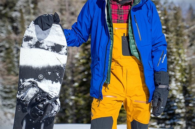 Why do Snowboarders Wear Bibs on One Shoulder
